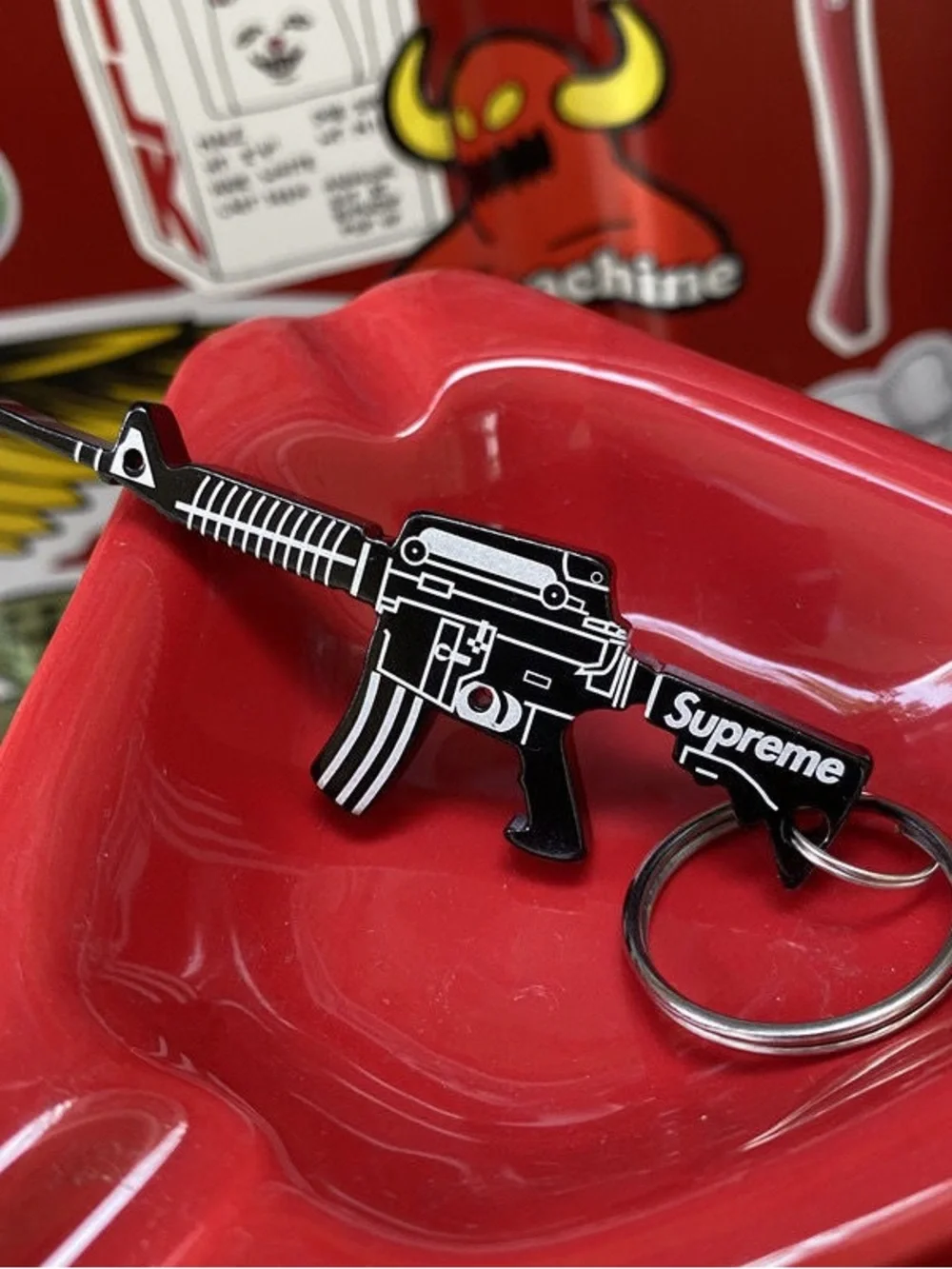 Supreme Black Rifle-Shaped Keychain Bottle Opener with Red Logo Sticker